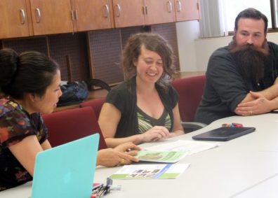 SESRC Director Lena Le (left) chats with survey clinic consultants Sarah Morton and James McCall.