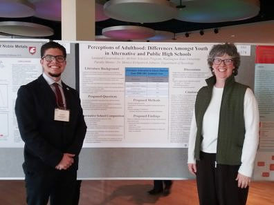 Undergraduate sociology major, Leo Covarrubias with department chair, Monica Johnson, standing next to Leo’s poster, presented at the Showcase for Undergraduate Research and Creative Activities (SURCA).