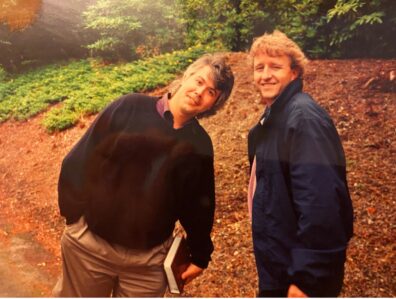 Clay and David are smiling towards the camera.