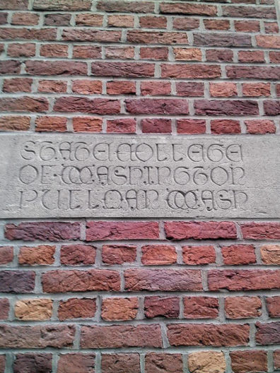 Carving on Library of Leuven references the State College in Pullman, WA