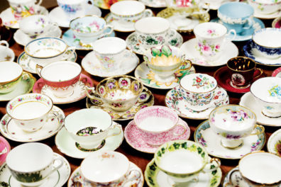 Various types of teacups sitting on a table next to each other