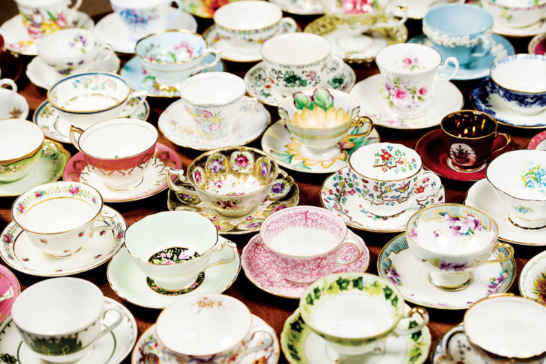 Various types of teacups sitting on a table next to each other