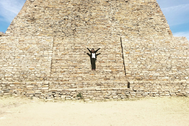 Doctoral student Miriam Fernandez standing at a pyramid.