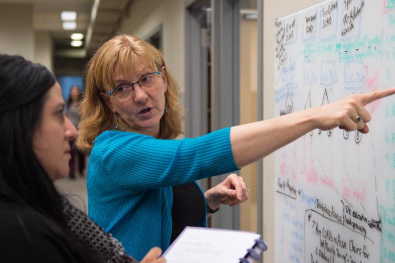 Physician Dawn DeWitt works with students at the Elson S. Floyd College of Medicine