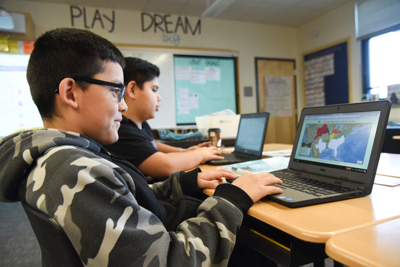 Two students uses PuzzleMap at Marcus Whitman Elementary School.
