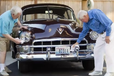 Seniors polishing up a classic antique 1950s Cadillac at Áegis of Bellevue. (Courtesy Áegis Living)