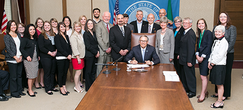 Gov. Jay Inslee signs Engrossed Substitute Senate Bill No. 5557, relating to services provided by pharmacists, on May 11, 2015.