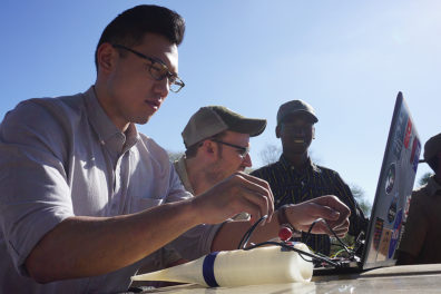 Three team members looking at data.