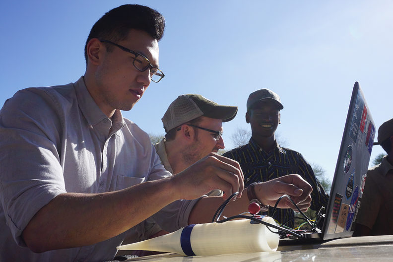 Three team members looking at data.