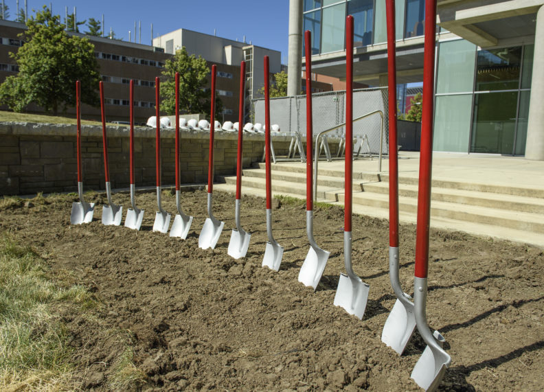 Ceremonial shovels wedged into dirt