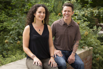 Closeup of Molly Kelton and Jeb Owen sitting outside.