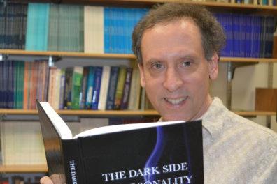 Closeup of David Marcus with book.