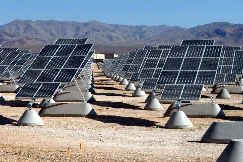 An array of solar panels on a solar farm.