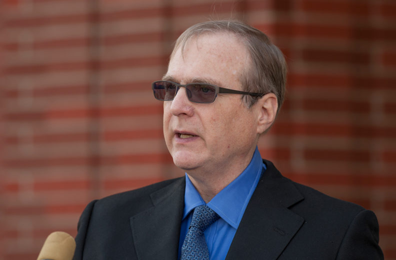 Paul Allen standing at podium.