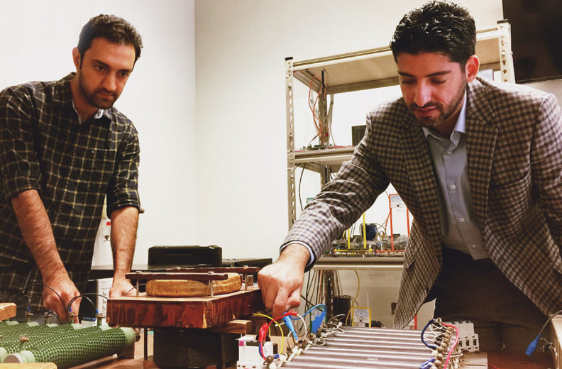 Mousavi and Mehrizi-Sani test a controller in their lab.