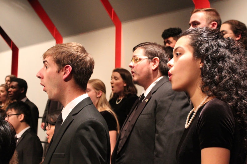 Closeup of choir members singing.