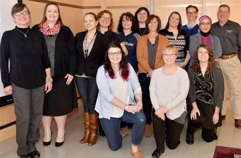 Members of the women's commission and WSU president Kirk Schulz.
