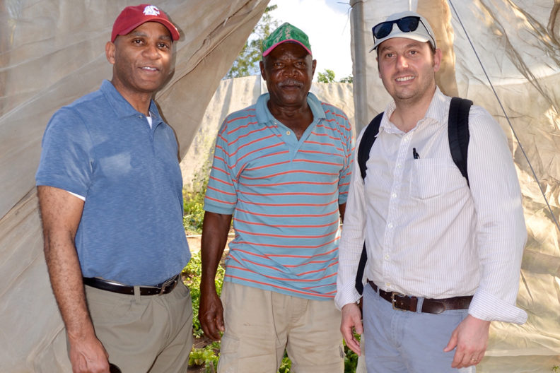 Pitre, Neri and Gromko standing in front of garden.