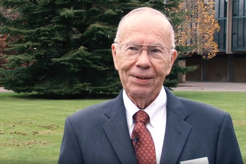 Closeup of Graedel in suit and tie.