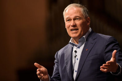 Washington Governor Jay Inslee on stage at the WSU Pullman campus.