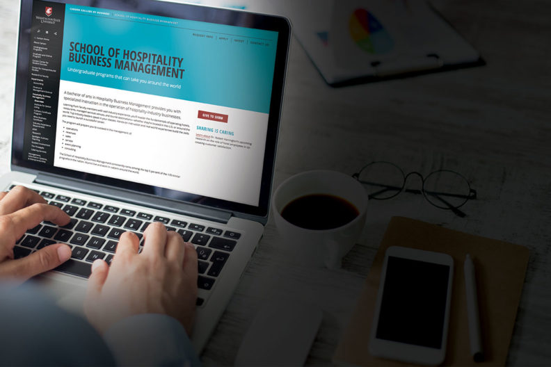 Computer showing the web page of the School of Hospitality Business Management