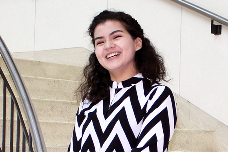 Stephany Lamas standing in stairwell.