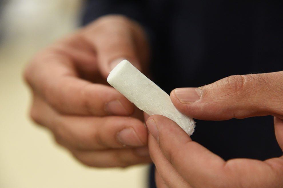 Closeup of someone’s hands holding a plant-based alternative to Styrofoam insulation.