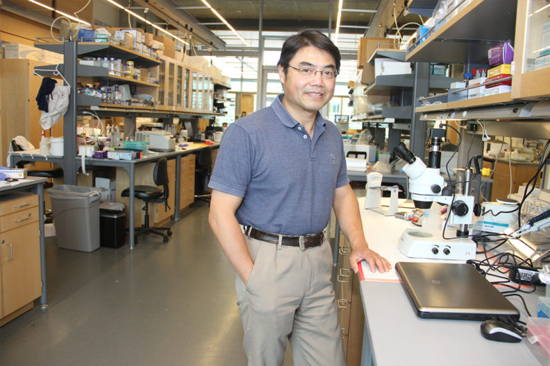 Min Du in his laboratory