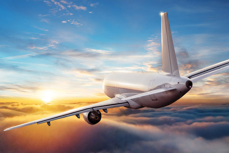 A passenger jet flying through the sky.
