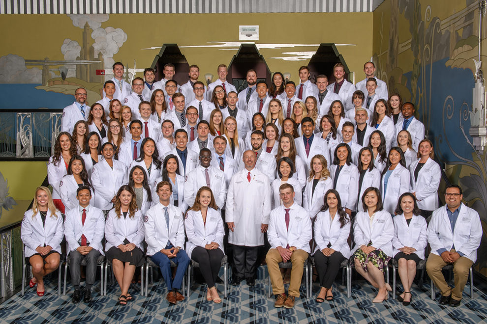Medical school students posing for a group photo.