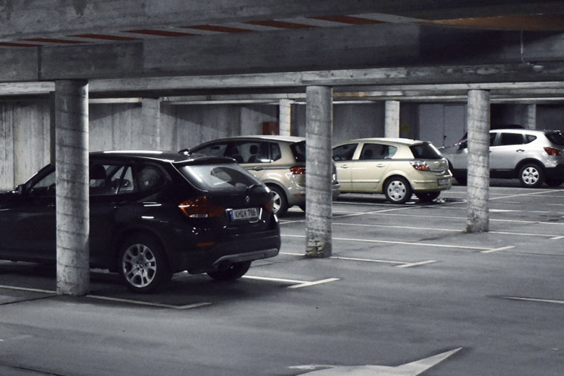 Cars parked in a parking garage.