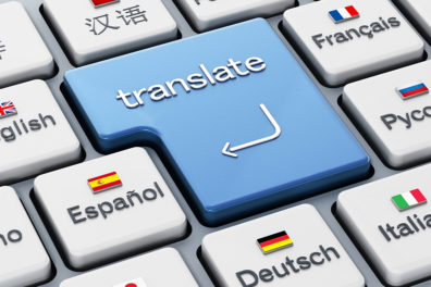 Computer keyboard with giant 'Translate' button surrounded by buttons representing other languages.