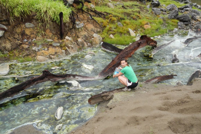WSU biologist Joanna Kelley takes water samples from a stream
