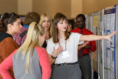A student presents on her research at the annual SURCA event.
