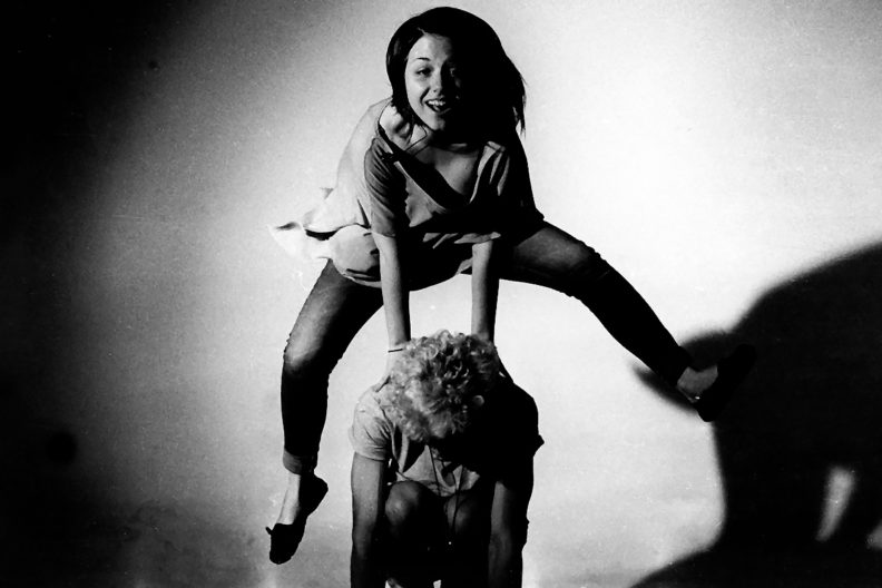 Children playing leap frog.