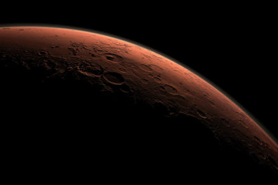 Computer-generated image of day break behind the curve of Mars.