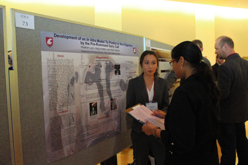A student presents her research at the 2019 SURCA event.