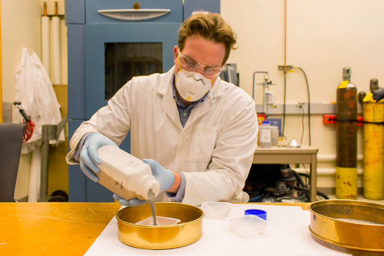 Kellen Traxel mixes together materials for 3D printing.