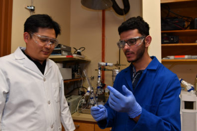 Professor Su Ha and PhD graduate Qusay Bkour work in the laboratory.