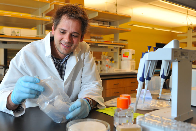 Closeup of Michael Letko working in a lab.