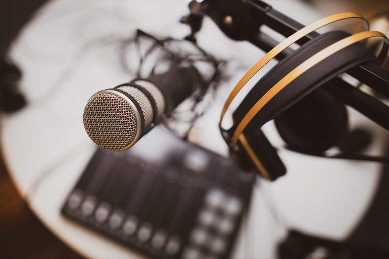 A recording microphone and headphones.