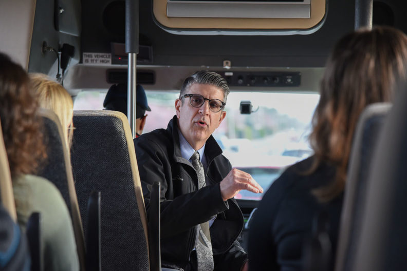 Michael Novakovich takes students on a bus tour of the Tri-Cities.