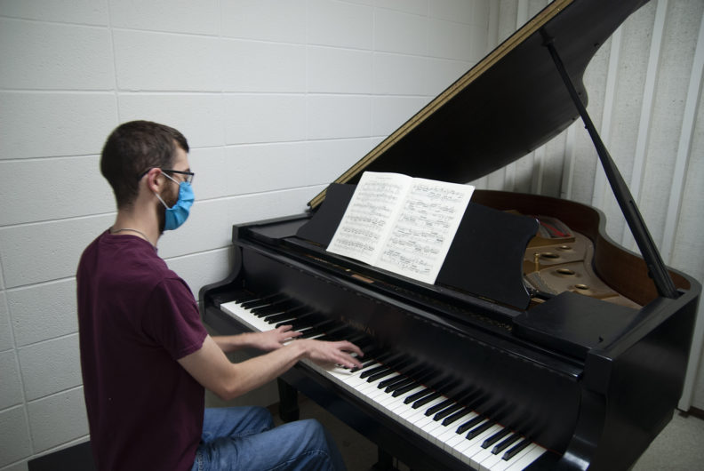 Master of Art student Joel Lininger practices piano