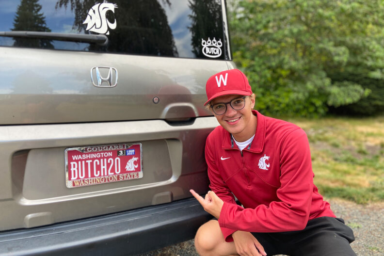 WSU alumnus displaying his Cougar license plate.