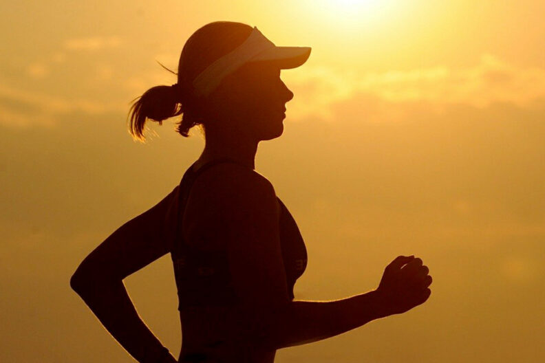Silhouette of woman running.