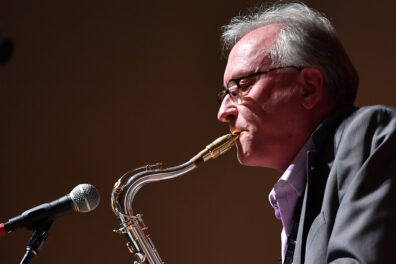 Closeup of Greg Yasinitsky playing saxophone.