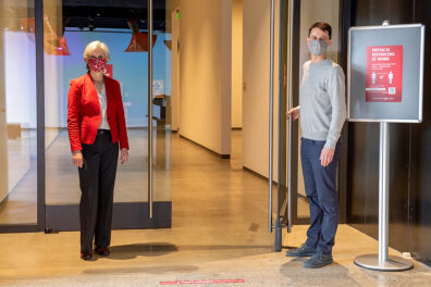 Provost Chilton and Ryan Hardesty stand beside an open door in the WSU Schnitzer Museum.