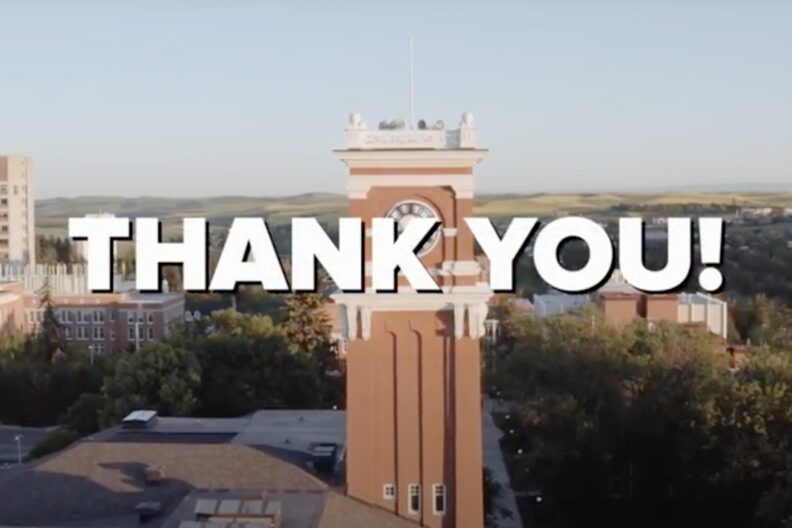 'Thank you!' text in front of an aerial view of the WSU Pullman campus.