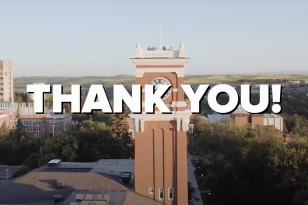 'Thank you!' text in front of an aerial view of the WSU Pullman campus.