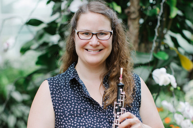 Keri McCarthy standing with a musical instrument